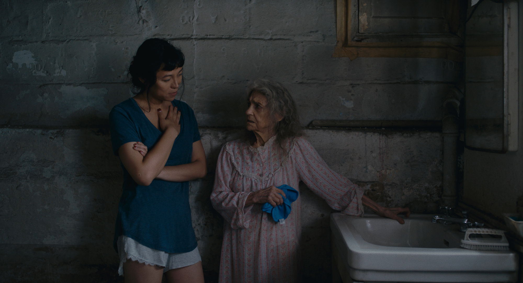 Isabel Sandoval plays Olivia, a caregiver to Olga played by Lynn Cohen.